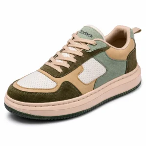 Three-quarter angle view of Zodack low-top colorblock sneaker in earthy olive green, tan, sage, and white leather with a peach cupsole