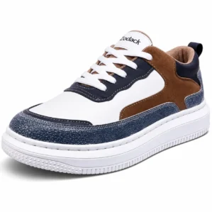 Three-quarter angle view of Zodack men's casual sneaker in white leather with pebble-textured blue mudguard, brown suede side panel, navy eyestays, and white laces